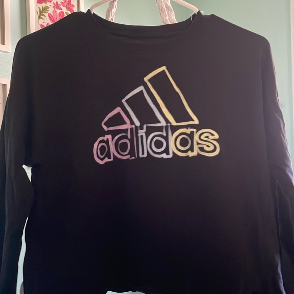 Black long sleeve adidas shirt.
